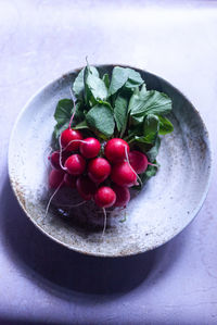 High angle view of strawberries in plate on table