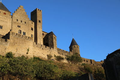 Low angle view of fort against clear sky