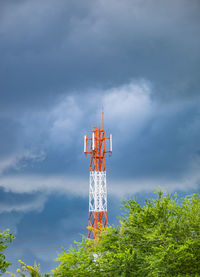 Low angle view of electricity pylon against sky