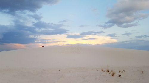 Scenic view of landscape against cloudy sky