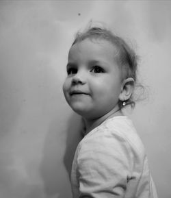 Portrait of cute smiling boy looking away