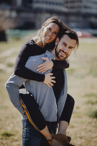 Midsection of couple standing outdoors