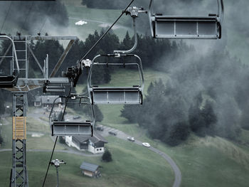 Empty chairlifts over land