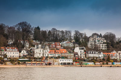 Beautiful houses and beaches on the banks of elbe river in hamburg on a cold end of winter day