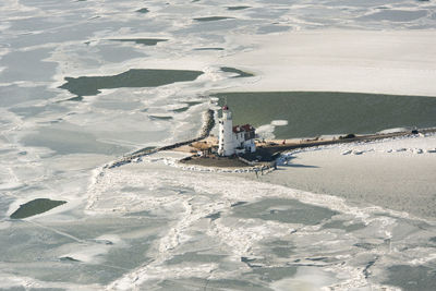 High angle view of lighthouse at beach