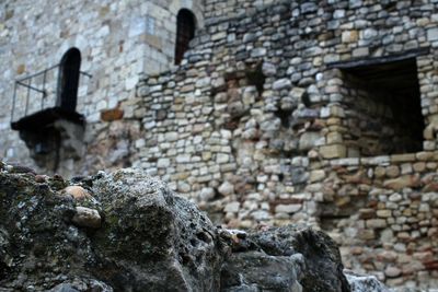 Low angle view of stone wall in old building