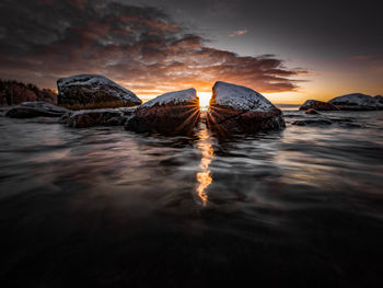 Scenic view of sea against sky during sunset