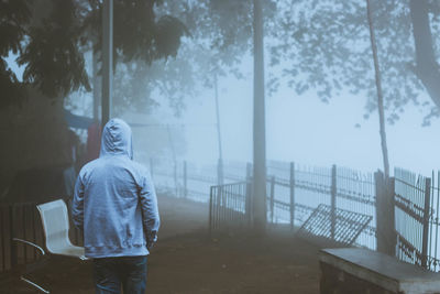 Man standing in fog