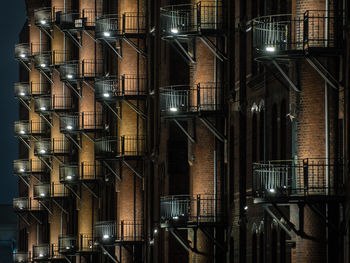 Low angle view of illuminated building at night