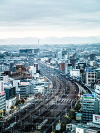 High angle view of buildings in city against sky