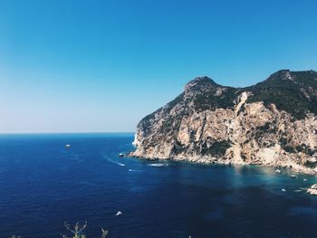 Scenic view of sea against clear blue sky