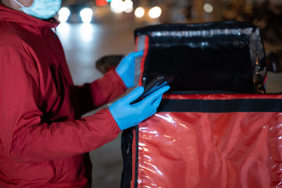 Rear view of man working at night