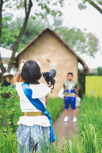 Rear view of couple on field