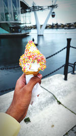 Midsection of person holding ice cream