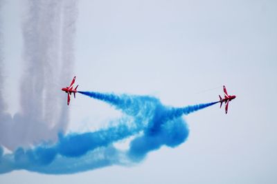 Low angle view of airplane flying in sky