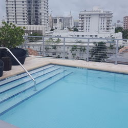 Swimming pool against buildings in city