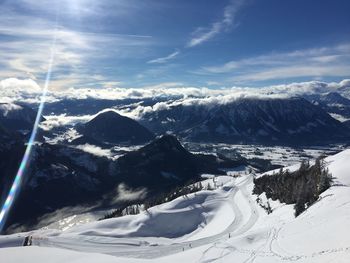 Scenic view of snow mountains against sky