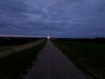 Road amidst landscape against sky