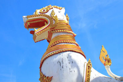 Low angle view of statue against sky