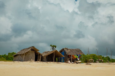 Built structure on beach against sky