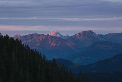 Scenic view of mountains against sky during sunset