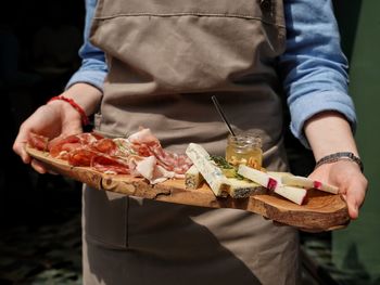 Midsection of woman preparing food