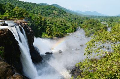 Scenic view of river flowing through rocks