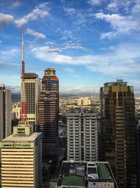 Modern buildings in city against sky