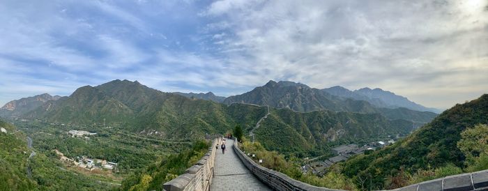 Panoramic view of road amidst mountains against sky