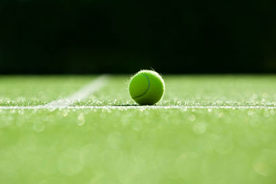 Close-up of tennis ball on playing field