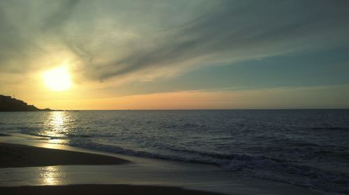 Scenic view of sea at sunset