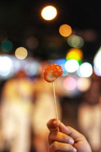 Close-up of hand holding illuminated lights