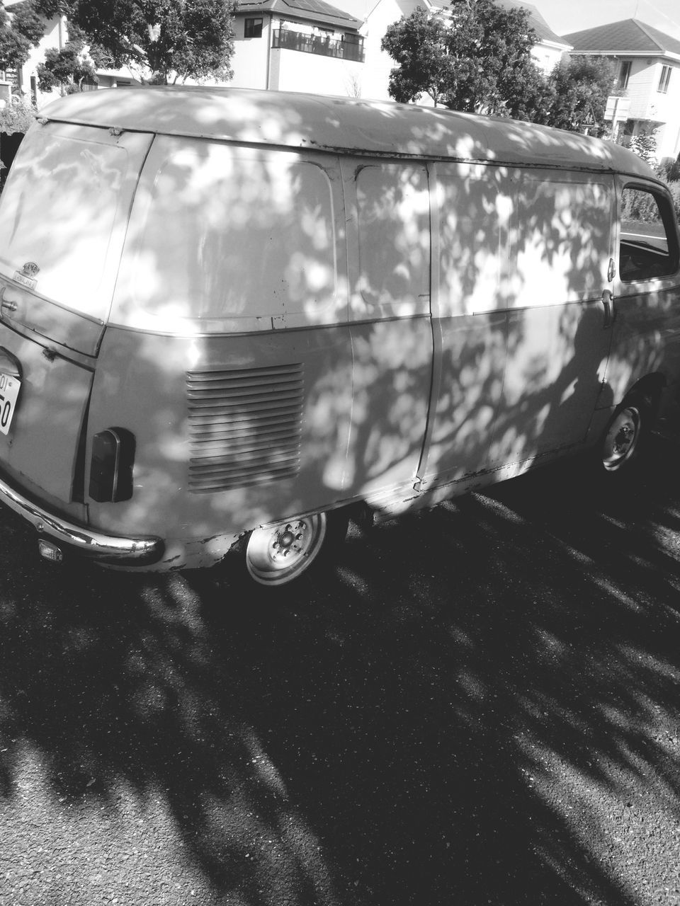 land vehicle, car, mode of transport, building exterior, transportation, reflection, built structure, architecture, street, sunlight, glass - material, close-up, day, no people, outdoors, stationary, window, shiny, tree, transparent