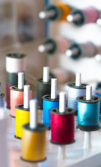 High angle view of multi colored candles on table