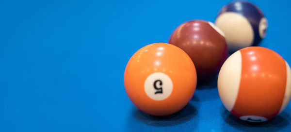 Close-up of pool balls on blue background