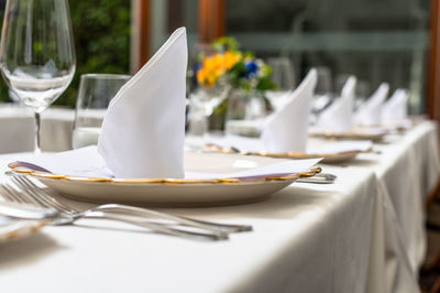 White drinking glass on table at restaurant