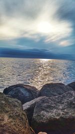 Scenic view of sea against cloudy sky