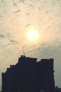 Low angle view of building against sky during sunset