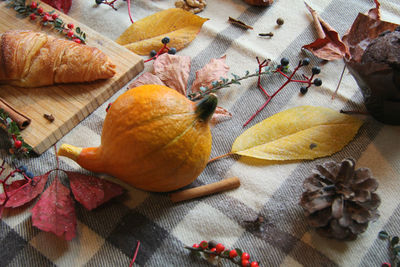 High angle view of orange leaves on table