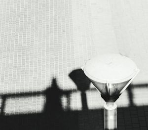 Shadow of drink on floor