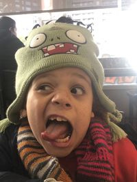 Close-up portrait of boy wearing hat