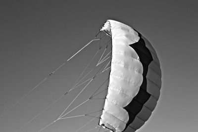 Low angle view of parachute against the sky