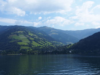 Scenic view of lake and mountains against sky