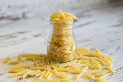 Close-up of yellow jar on table