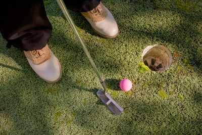 Low section of man playing golf