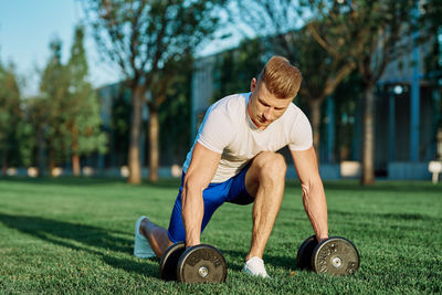 Side view of man exercising in park