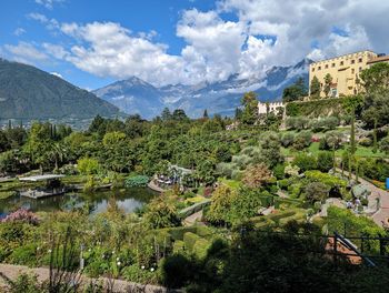 High angle view of townscape and mountains against sky