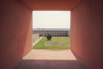 Footpath seen through window of building