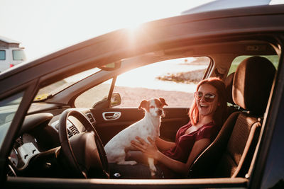 Portrait of woman sitting in car