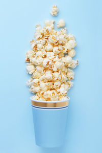 High angle view of food in bowl on blue background